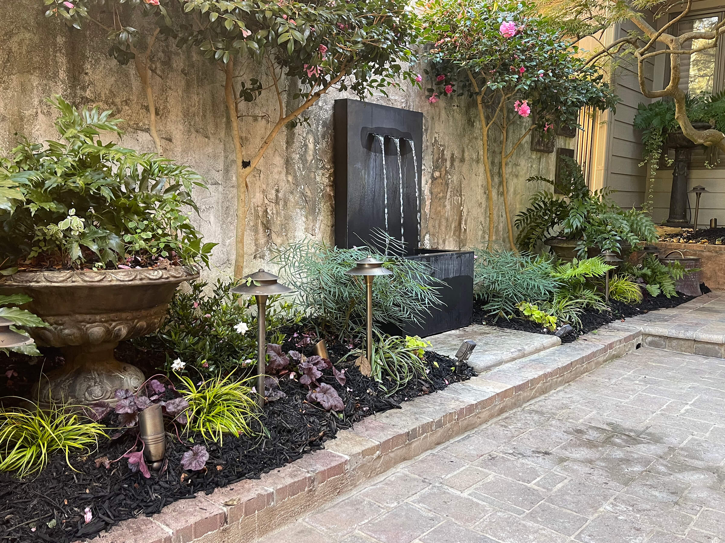 Garden with water feature and lightingi